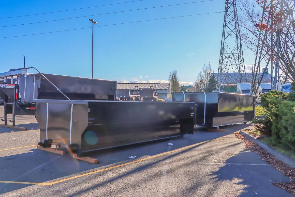 Roll-off dumpster ready for waste disposal at job site for 2 Yard Dumpster Rental in Old Fig Garden
